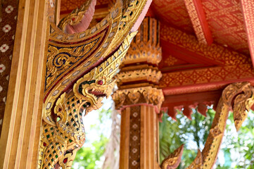 Fototapeta na wymiar Naga stone statue Located on the way up the stairs of the temple in Bangkok, Thailand.