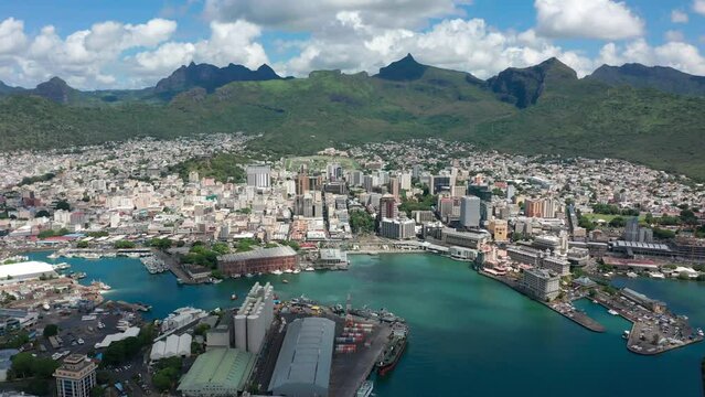 Aerial view Port Louis on beautiful sunny day. Capital of the island of Mauritius. Tall buildings on the Indian Ocean. Offshore banking system
