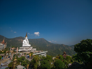 5 White Buddha Statues Sitting on The Hill