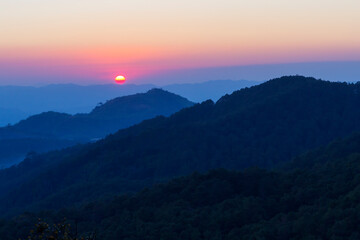 Fototapeta na wymiar Sunset evening with silhouette mountain