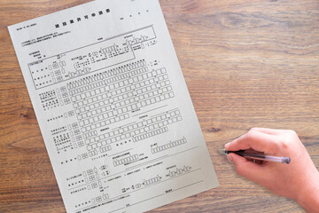 Obraz premium 都道府県に提出する建設業許可申請書（手）