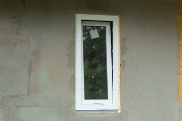 Fototapeta na wymiar White metal-plastic window in a new building