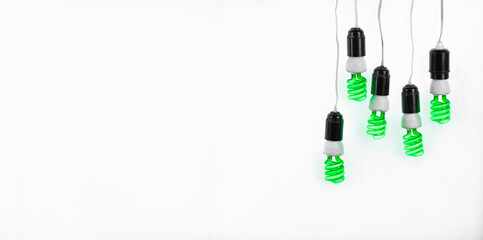 fluorescent spiral green light bulbs isolated on white background