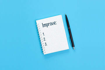 The word Improve is written on a notebook page