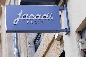 Jacadi Paris text logo and brand sign facade boutique clothing shop for children