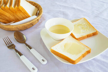 .Bread and sweetened condensed milk on the table