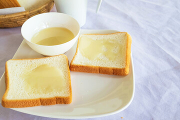 Breakfast, bread and milk on the table