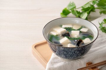 Delicious tofu and century egg soup with coriander.