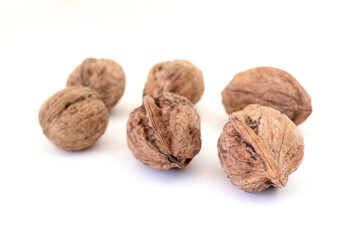 Shelled walnuts isolated on a white background.