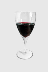 Glass with red wine isolated on white background.