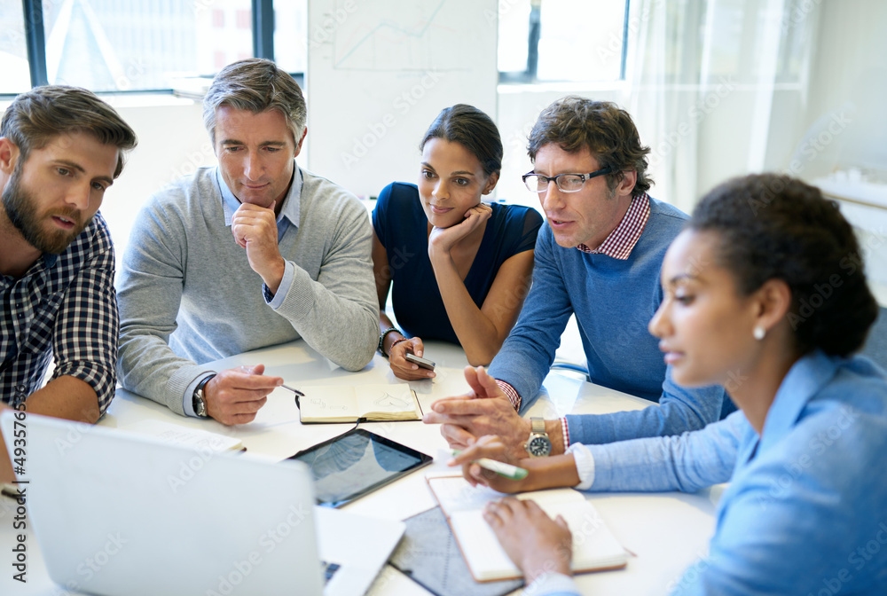 Poster faster, more efficient meetings with the help of technology. a group of business colleagues discussi