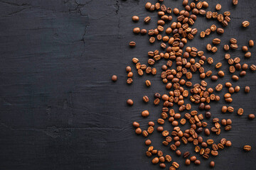 Coffee beans roasted on a black background