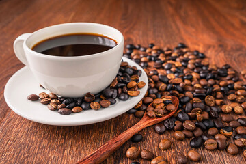 Coffee cups and coffee beans on a wooden table