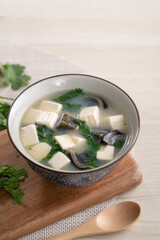 Delicious tofu and century egg soup with coriander.