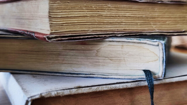 closeup old book stack for interior design decorative house - abstract background image