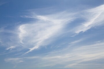 White clouds on a sky blue sky background.
