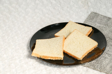 Plain toasted bread whole. White bread toast slice.