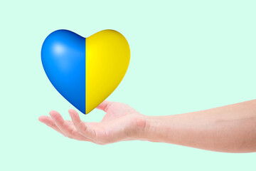 Hand with Heart colored national flag of Ukraine.