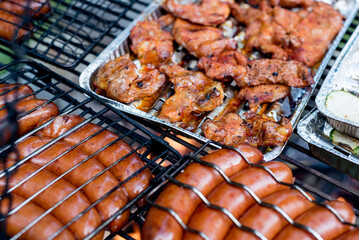 Grilled sausages over the fire.
