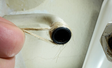 Seal heating pipe with hemp. Replace thermostat valve on radiator heating. Hand repaired screw...
