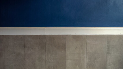 Plaster wall with blue, white, gray colors.