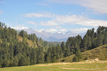 View of beautiful himalayas from in between mountains of Himachal Pradesh 