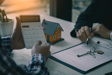 Sales agents offer interest rate contracts on home installments and home purchases for clients to...
