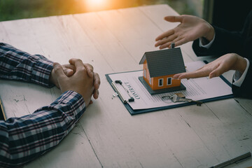 Sales agents offer interest rate contracts on home installments and home purchases for clients to...