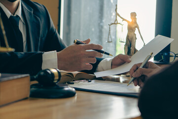 Consultation between male lawyers and real estate business clients Legal counsel presents the...