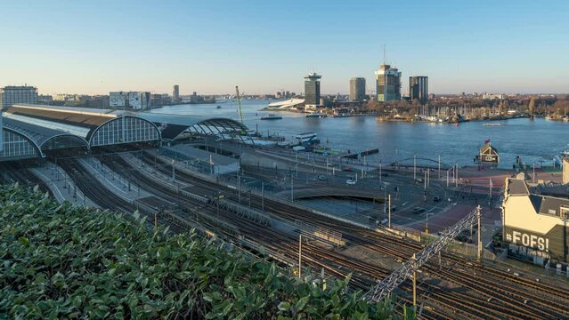 4k time lapse of the Amsterdam central station and IJ river during sunset