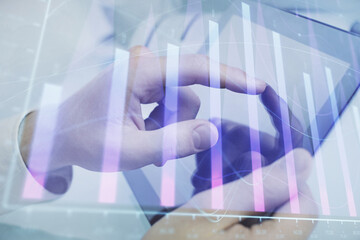 Multi exposure of man's hands holding and using a phone and financial chart drawing. Market analysis concept.