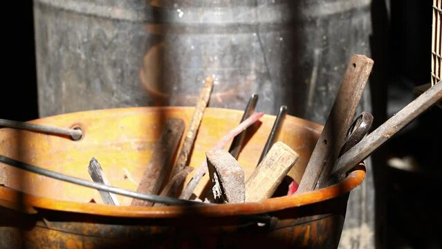 ellow plastic bucket filled with work tools