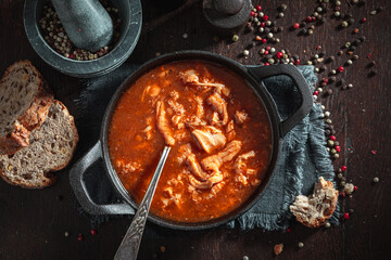 Delicious and homemade tripe soup made of vegetables and beef.