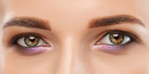 Beautiful eyes of a woman with bright make-up close-up.  makeup and healthy clean skin. Professional makeup concept