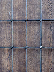 Forged lattice on a wooden door