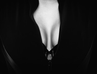 Beautiful slender woman in a tight black sweater.Photo black and white