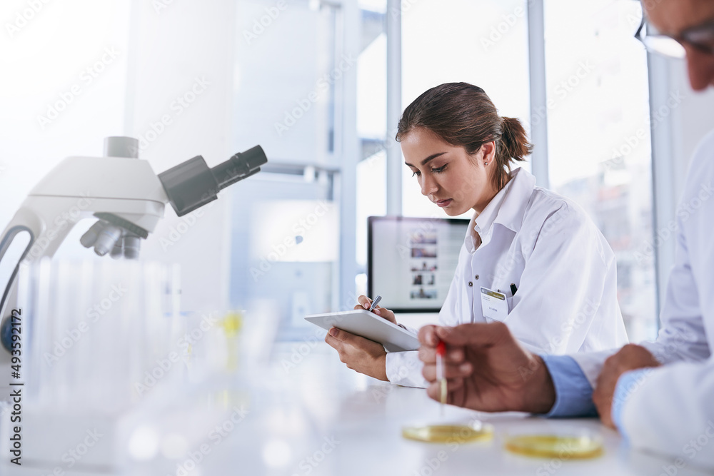 Aufkleber its a high-tech workspace. shot of two scientists working in a lab.