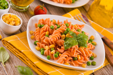 Fusilli pasta with peas and sweet corn.