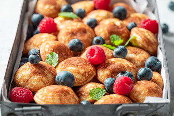 Dutch and sweet mini pancakes as a Danish breakfast. - obrazy, fototapety, plakaty