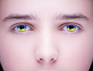 Reflection Flag of Ukraine in beautiful teenager eyes