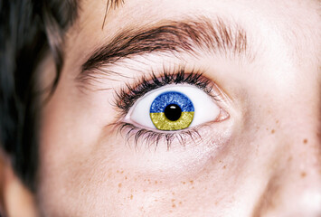 Fototapeta premium Flag of Ukraine in beautiful boy eye