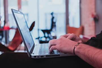 Close-up Of A Man's Hand Working On Laptop. Selective Focus 