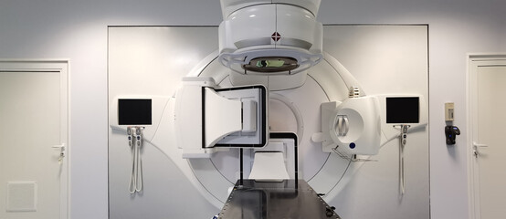 A part of modern linear accelerator in oncological cancer therapy in a modern hospital. - obrazy, fototapety, plakaty
