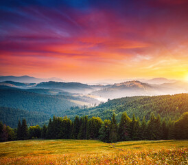 Spectacular summer sunset scene in the mountains with perfect sky. Carpathian mountains, Ukraine.
