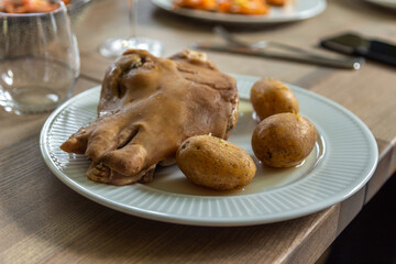 A sheep head with boiled potatoes, a traditional Faroese dish. Faroe Islands.