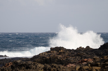 Fototapeta na wymiar Wave breaking against the shore. El Confital. La Isleta Protected Landscape. Las Palmas de Gran Canaria. Gran Canaria. Canary Islands. Spain.