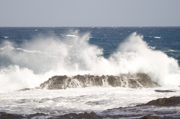 Wave breaking against the shore. El Confital. La Isleta Protected Landscape. Las Palmas de Gran Canaria. Gran Canaria. Canary Islands. Spain.