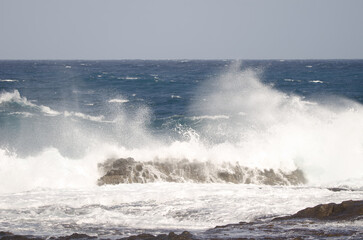 Wave breaking against the shore. El Confital. La Isleta Protected Landscape. Las Palmas de Gran Canaria. Gran Canaria. Canary Islands. Spain.