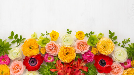 Fototapeta premium Beautiful flowers composition. Arrangement of anemones, roses, ranunculus, tropical flowers, succulent and leaves on light background.