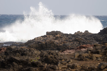 Wave breaking against the shore. El Confital. La Isleta Protected Landscape. Las Palmas de Gran Canaria. Gran Canaria. Canary Islands. Spain.